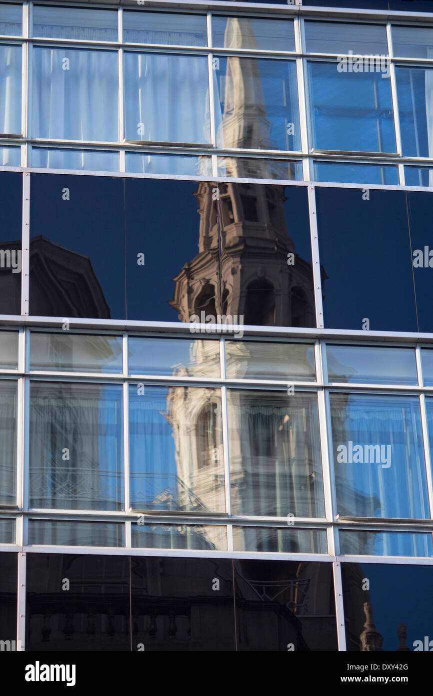 St Bride's Church Fleet Street wedding cake tower reflected in windows of the former Daily Express building London England UK Stock Photo