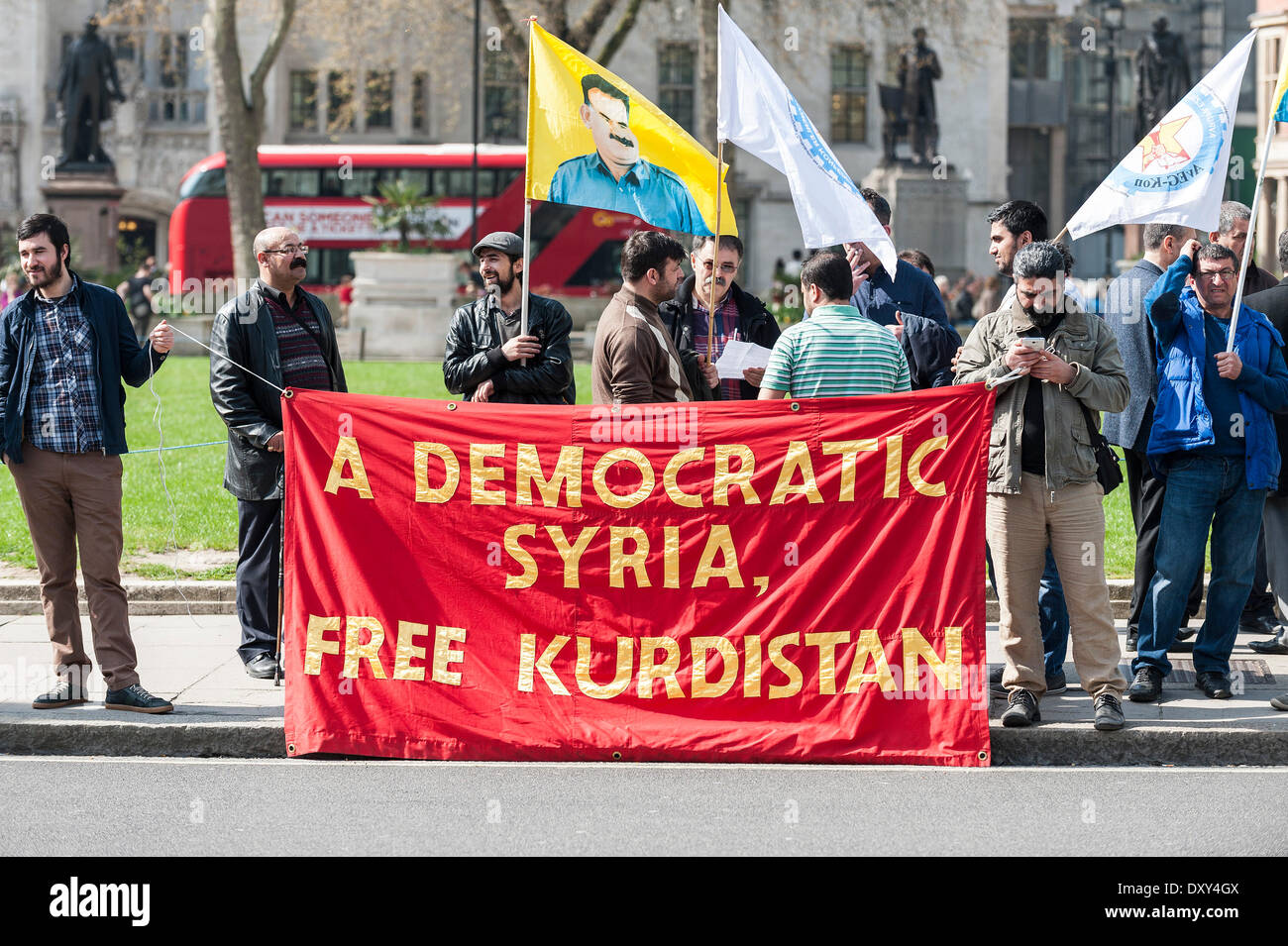 London, UK. 1st April 2014. Tuesday 1st April, 2014.  Banners and flags carried by Kurds protesting outside the gates of Parliament in Westminster. Photographer: Gordon Scammell/Alamy Live News Stock Photo