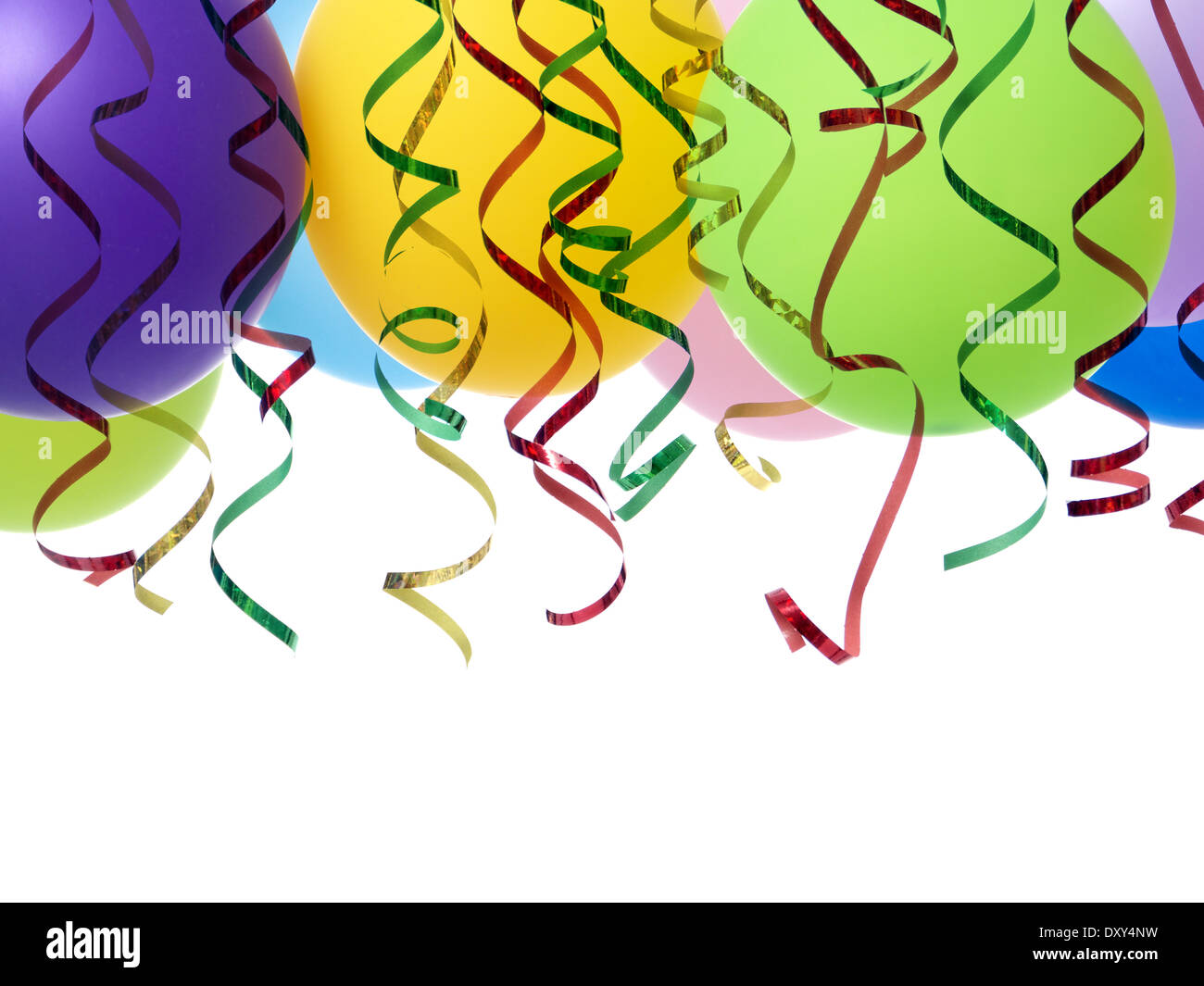 Bunch of colorful party balloons and streamers shot on white Stock Photo