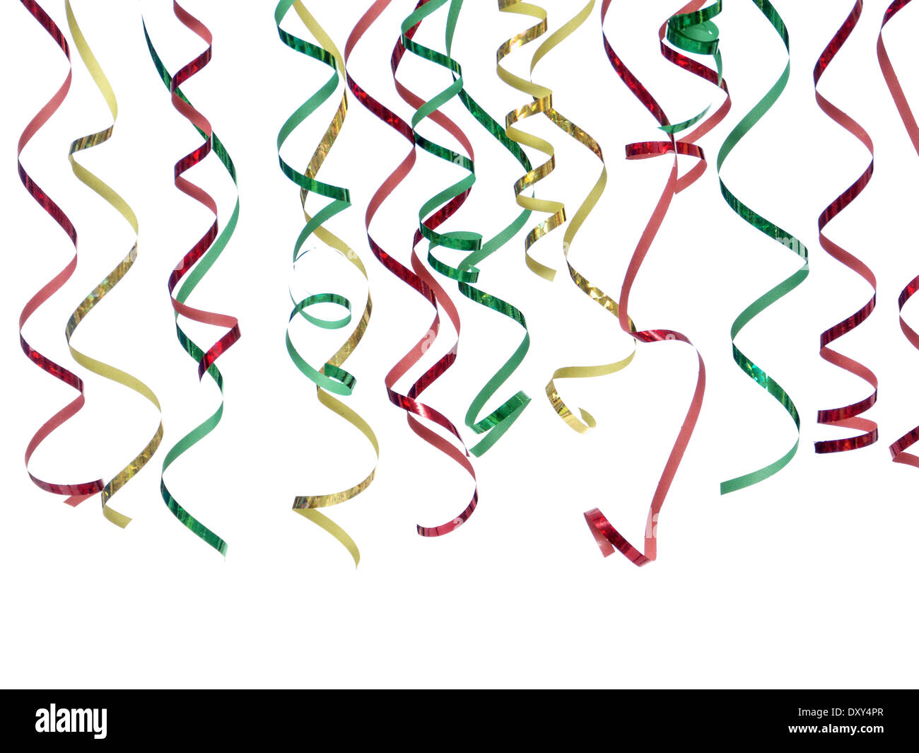 Colorful twisted party streamers in red, green and golden color Stock Photo