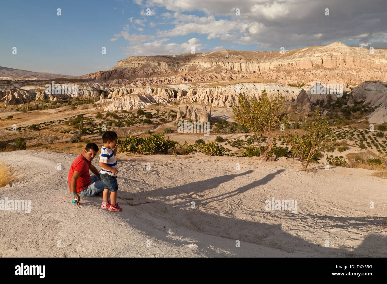 A father and son enjoying the views of the Rose Valley in Cappadocia Stock Photo