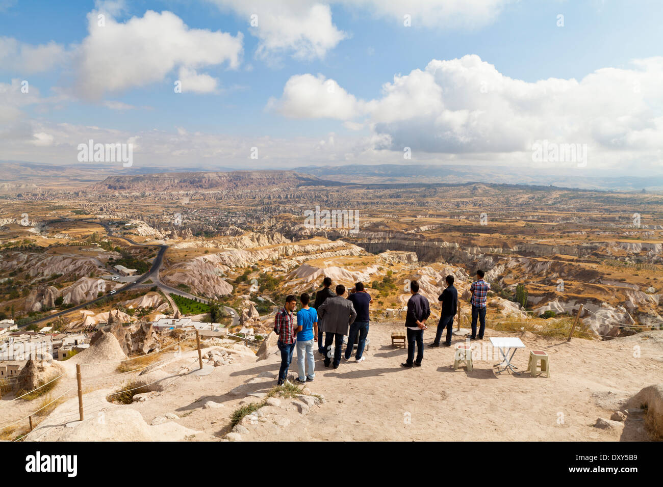 People looking at the landscape from the top of Uchisar Castle Stock Photo