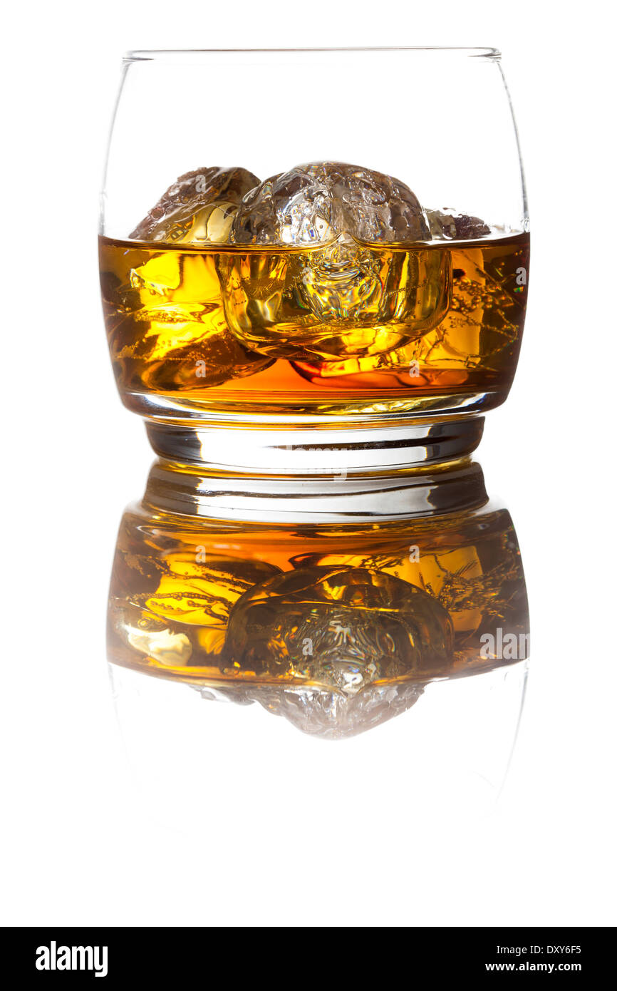 Alcoholic Amber Whiskey Bourbon in a Glass with Ice Stock Photo