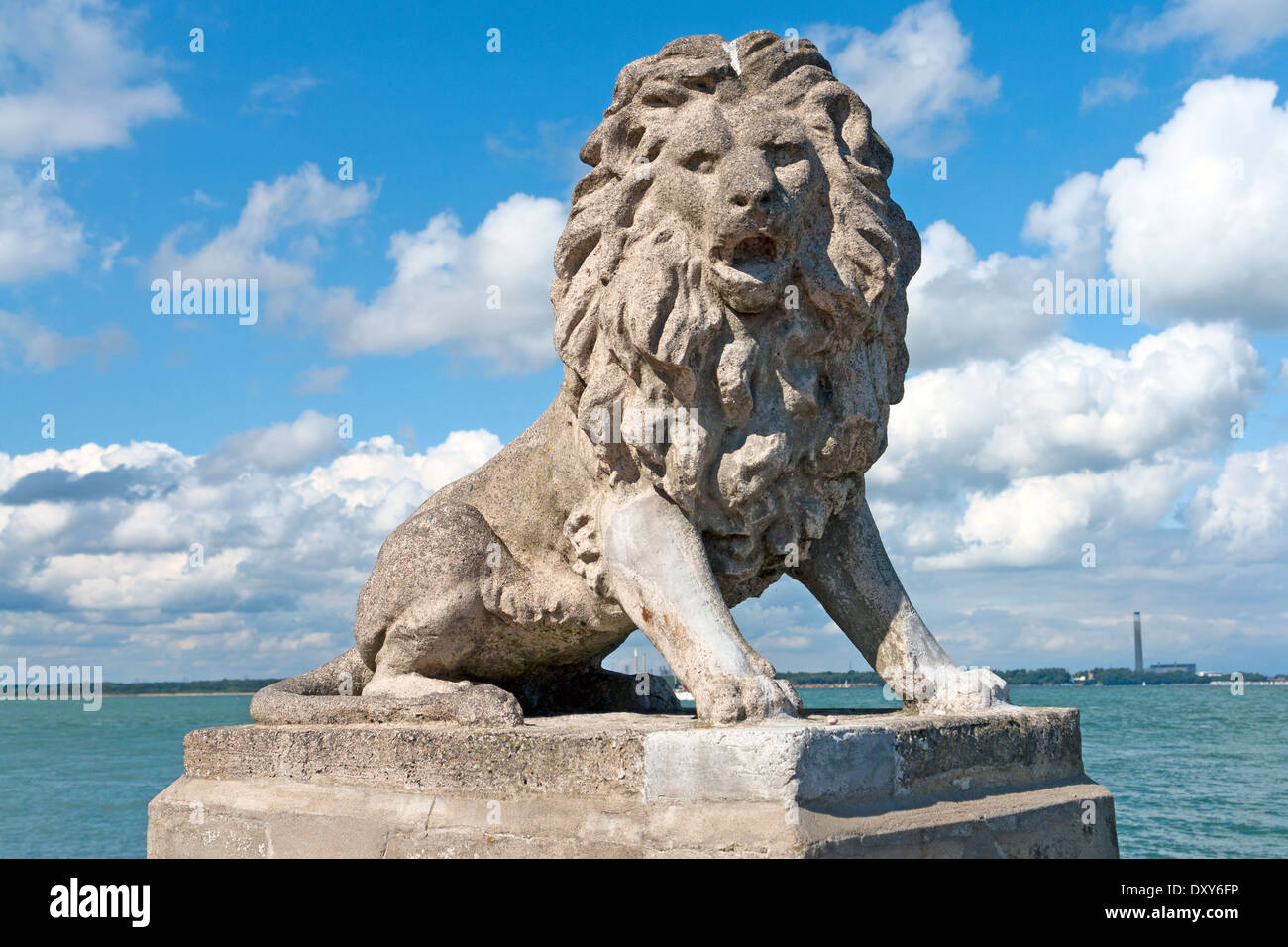 One of several lion statues on the Esplanade, West Cowes, Isle of Wight, with the Solent in the background Stock Photo