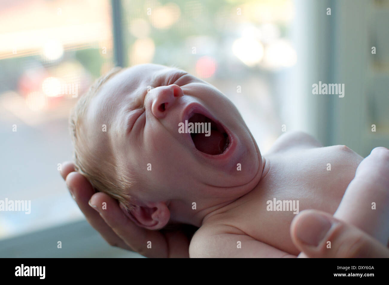 Newborn baby boy yawning Stock Photo