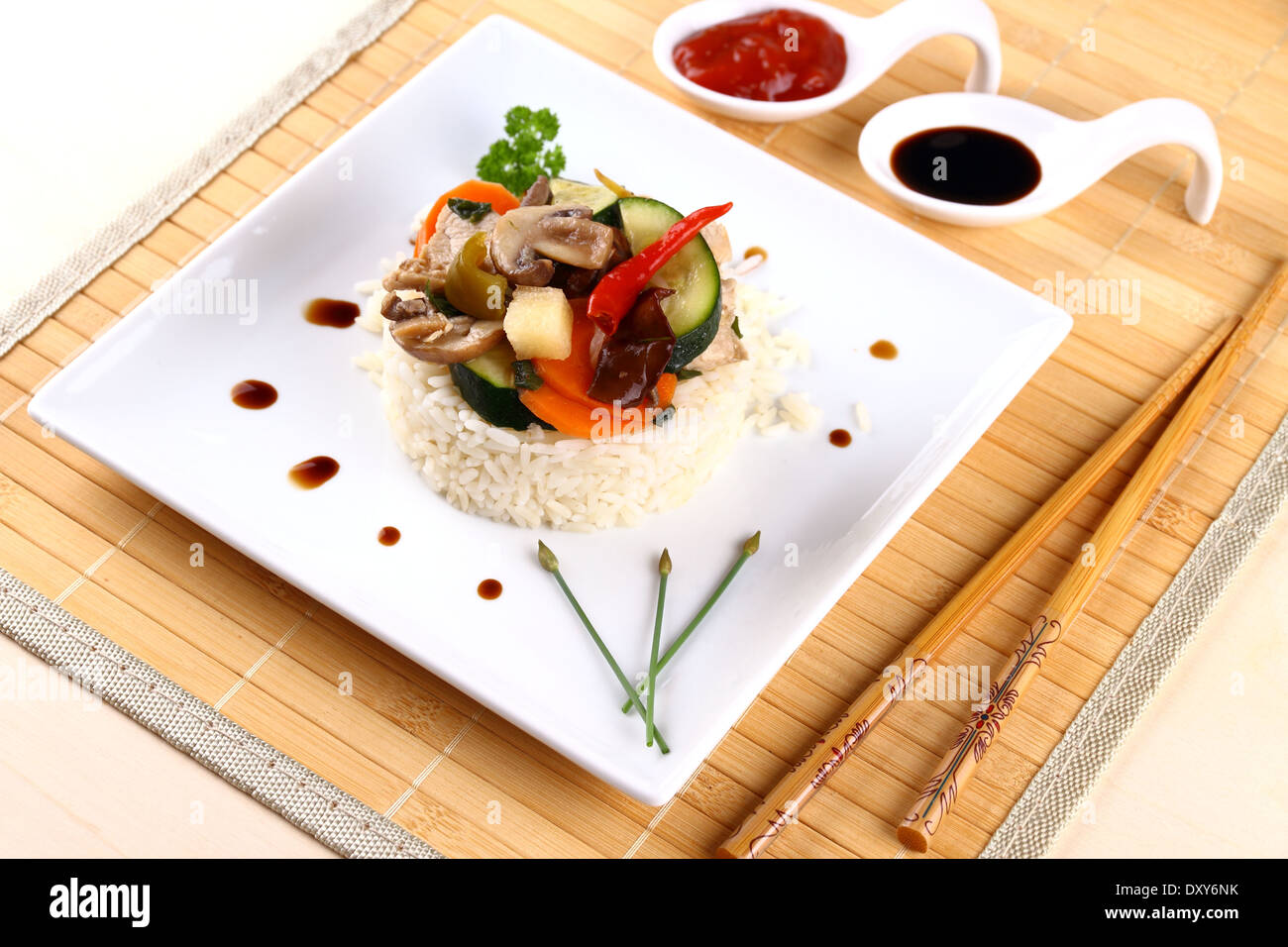 Chicken meat, asian rice, zucchini, carrots, mushroom, top view Stock Photo