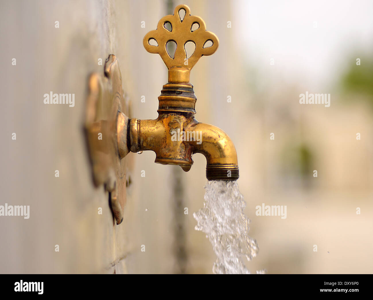 Antique Turkish faucet on wall Stock Photo