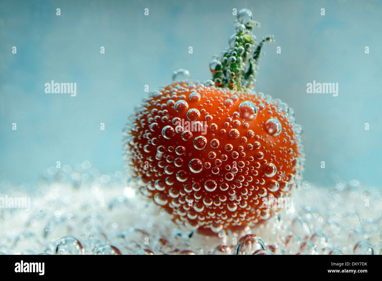 cherry tomato with bubbles underwater Stock Photo
