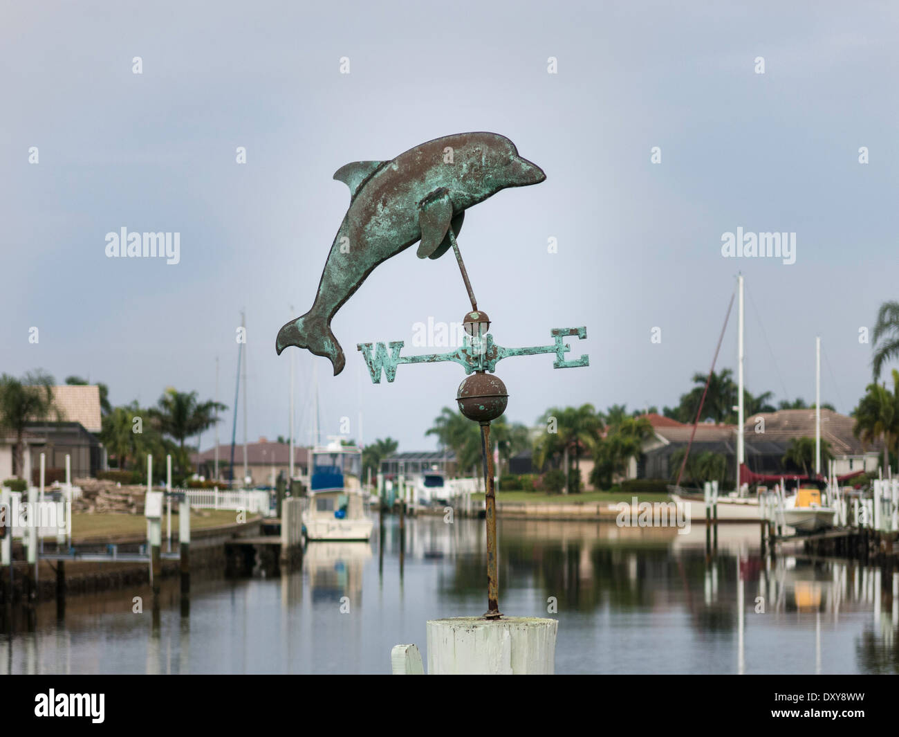 Private Residential Canal Front Dock with Dolphin Weather Vane,  Punta Gorda, FL, USA Stock Photo