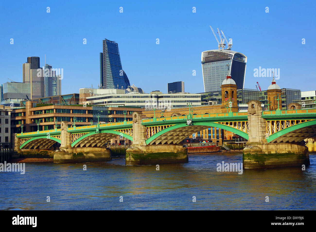 River Thames with Southwark Bridge and the City of London skyline in London, England Stock Photo