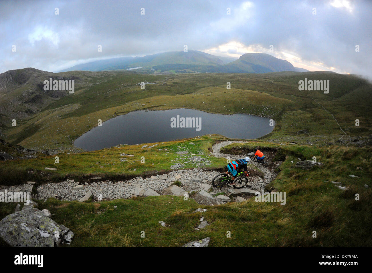 Snowdone Ranger Path Two mountain bikers ride down the rangers path on mount Snowdon in the ...