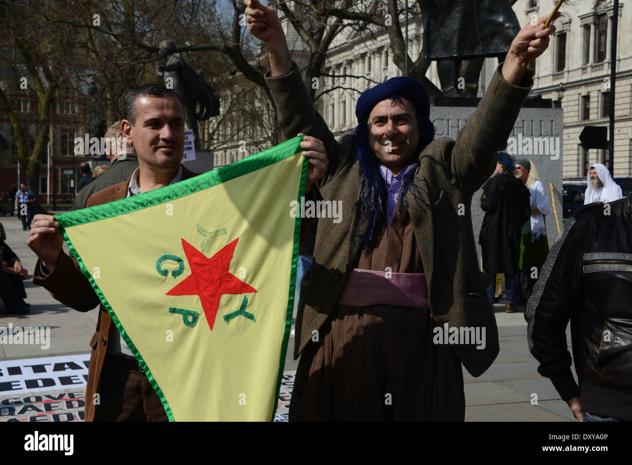 London, UK. 1st April 2014 : Kurds protested outside Parliament. Protesters say the Turkey's and Saudi Arabia Government supports terroists against Syrian Kurds in Syria and Kurdistan. Photo by See Li/Alamy Live News Stock Photo