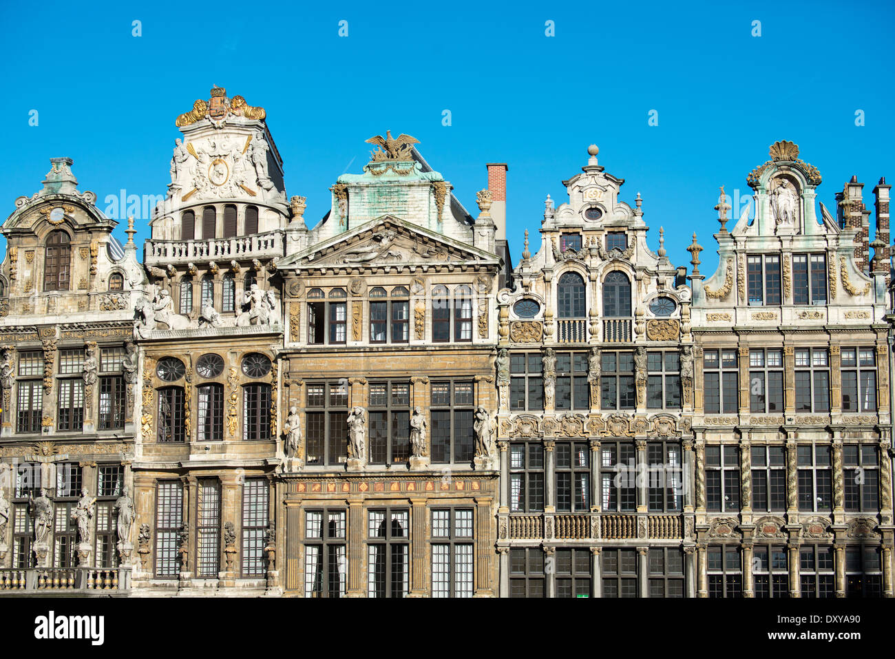 Historic guidhalls lining the northwest side of the Grand Place (La Grand-Place), a UNESCO World Heritage Site in central Brussels, Belgium. Lined with ornate, historic buildings, the cobblestone square is the primary tourist attraction in Brussels. Stock Photo