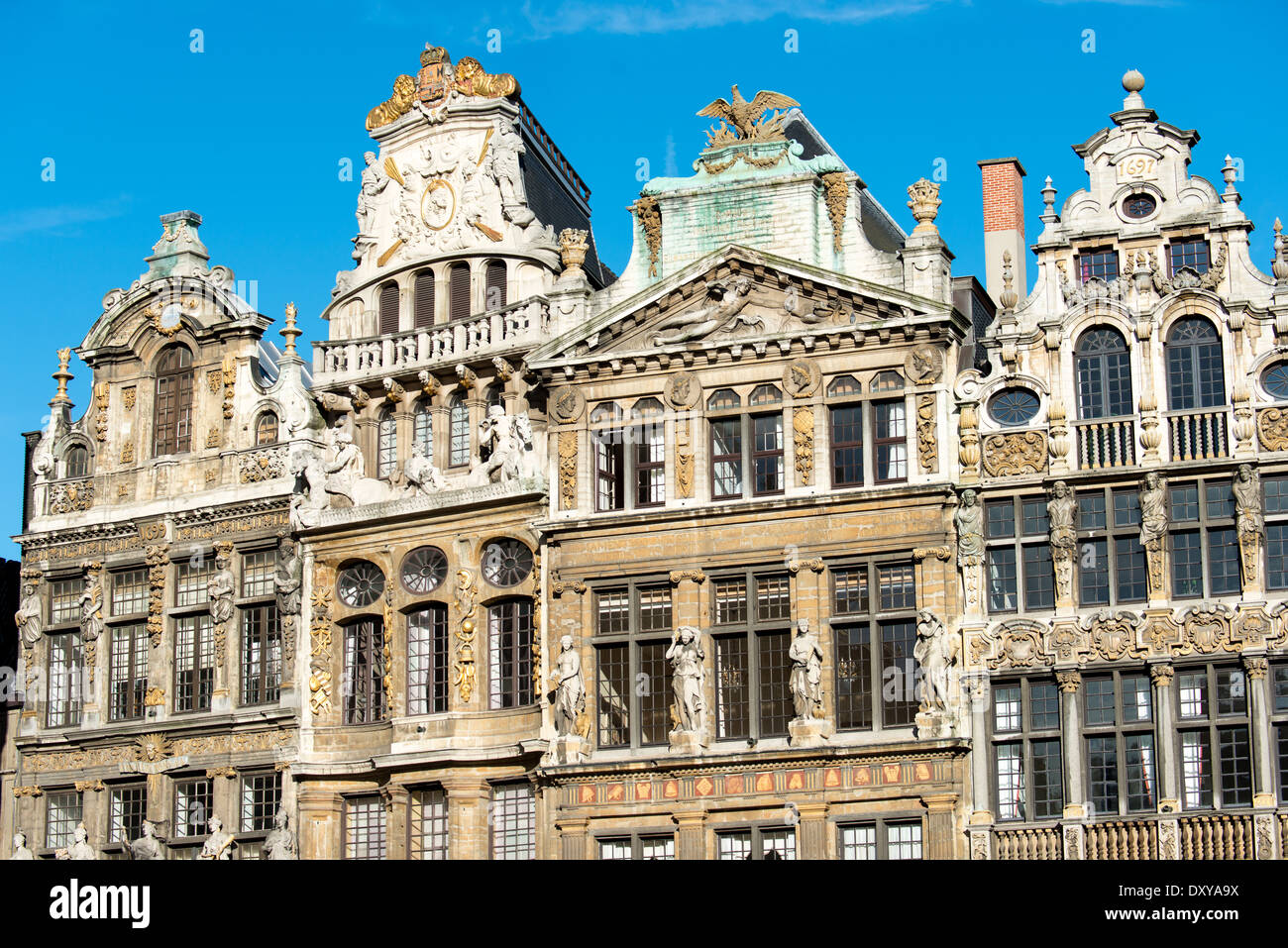 Historic guidhalls lining the northwest side of the Grand Place (La Grand-Place), a UNESCO World Heritage Site in central Brussels, Belgium. Lined with ornate, historic buildings, the cobblestone square is the primary tourist attraction in Brussels. Stock Photo