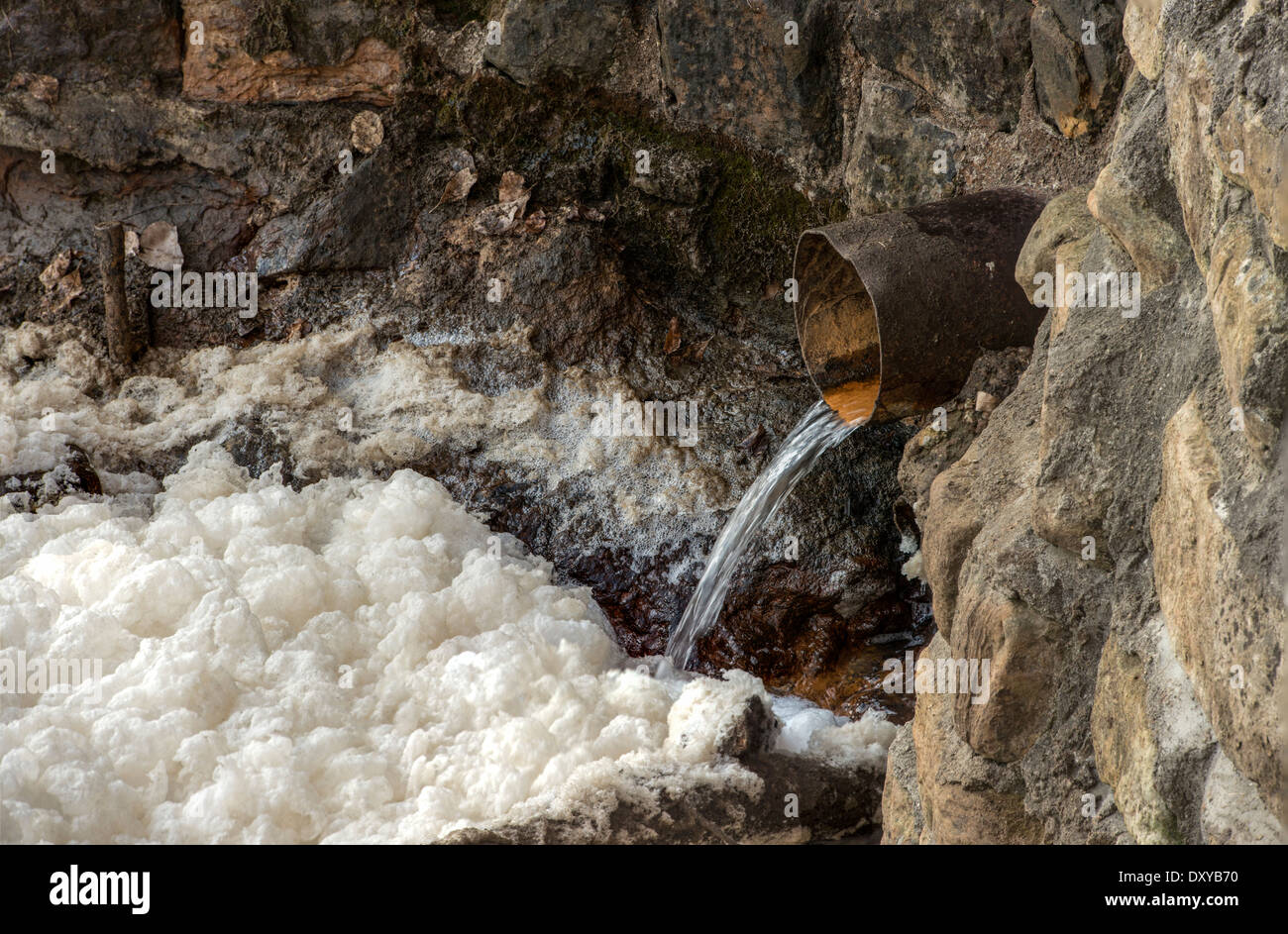 Runoff spills from a drainage pipe into Sand Creek directly below Sand