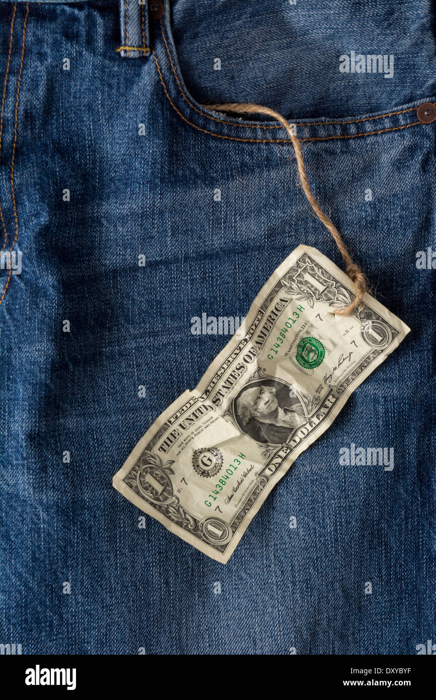 Concept photo for rightward or stingy person with one dollar bill attached to string coming out of blue jean pocket Stock Photo