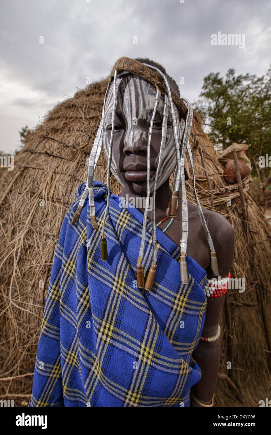 Mursi boy with watch band jewelery in the Lower Omo Valley of Ethiopia Stock Photo