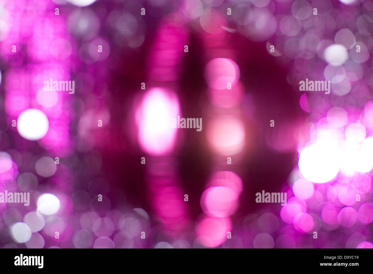 Sparkling pink disco ball on an abstract swirl background Stock Photo -  Alamy