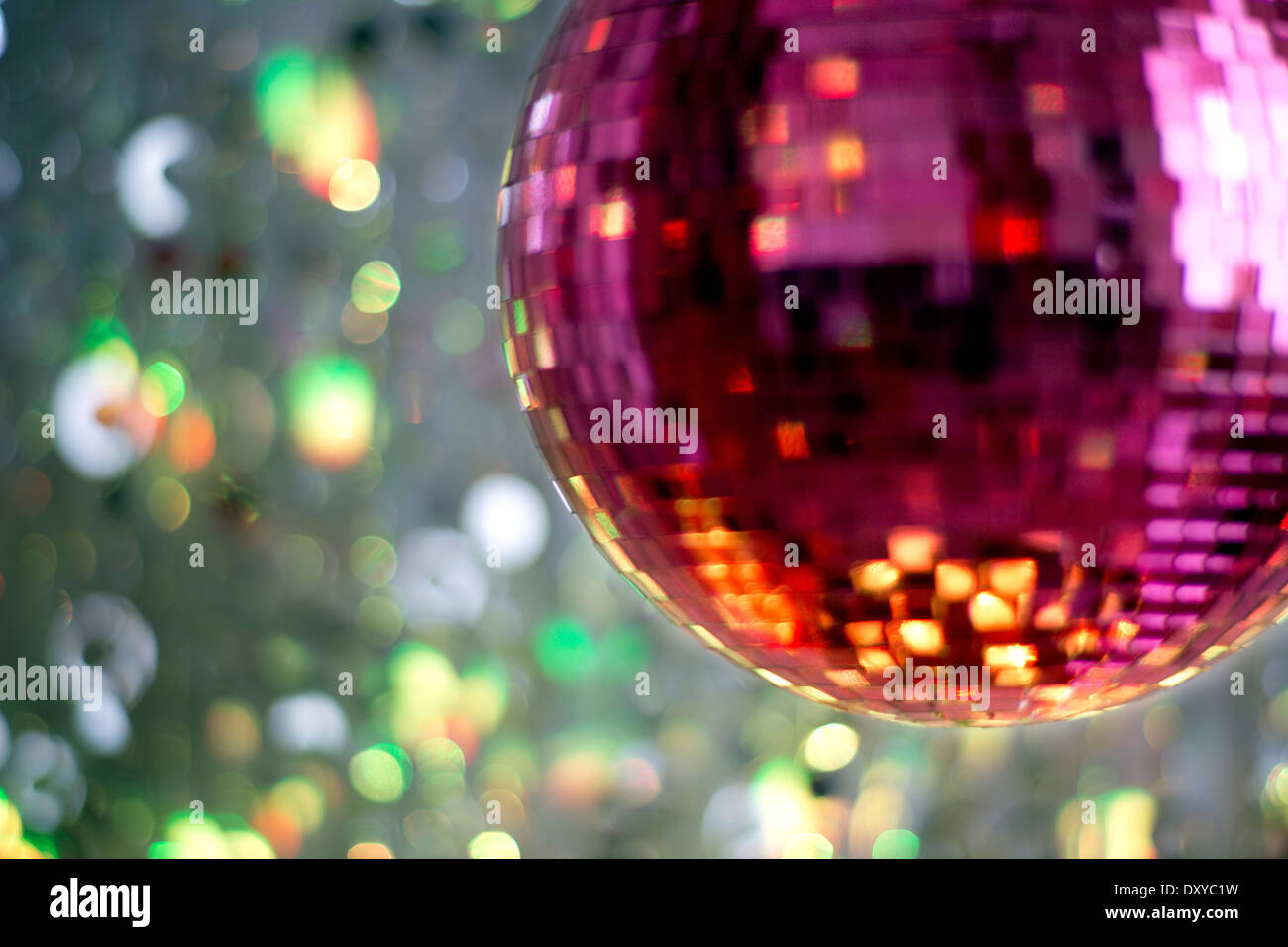 pink discoball with colured background Stock Photo