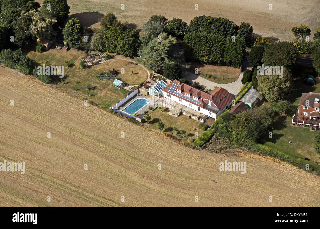 aerial view of modern housing with solar panels on the roof, expensive detached house with swimming pool Stock Photo