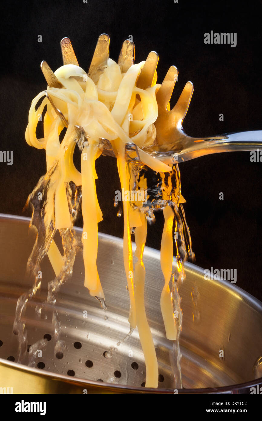 Tagliatelle is a traditional type of pasta from Emilia-Romagna and Marche, regions of Italy. Stock Photo