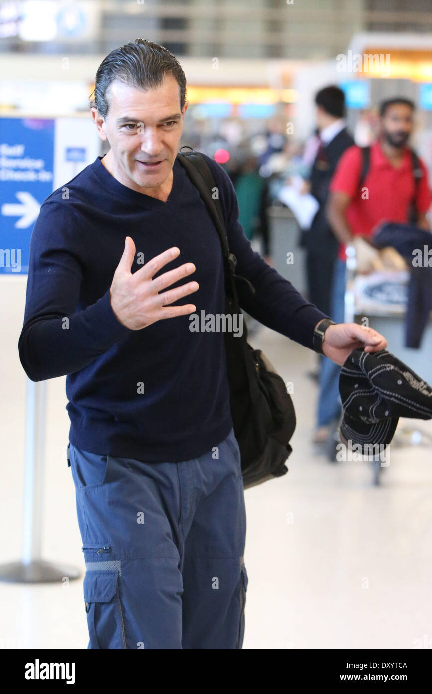 Antonio Banderas meets with a friend as he arrives at LAX Airport to board  an Air