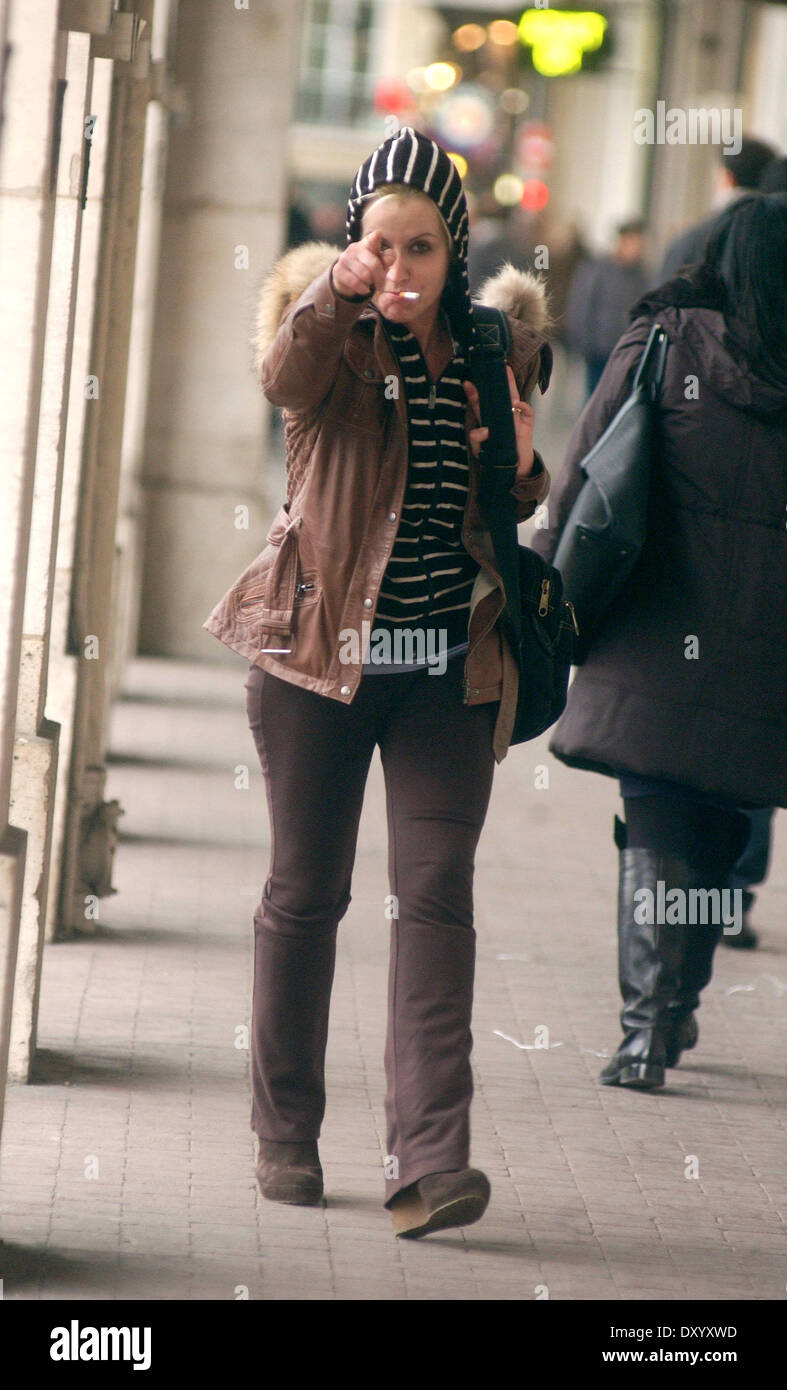 Dolores O'Riordan of the Cranberries plays hide and seek with photographers  whilst out and about in Paris Featuring: Dolores O'Riordan Where: Paris,  France When: 28 Nov 2012 Stock Photo