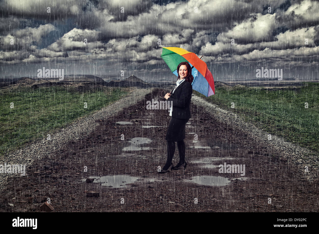 businesswoman with umbrella and rain Stock Photo