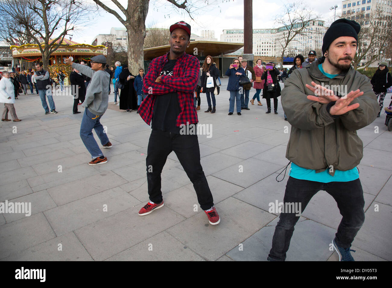 King Corville street performers perform a Gangnam Style street dance to a delighted audience on the South Bank, London, UK. Stock Photo