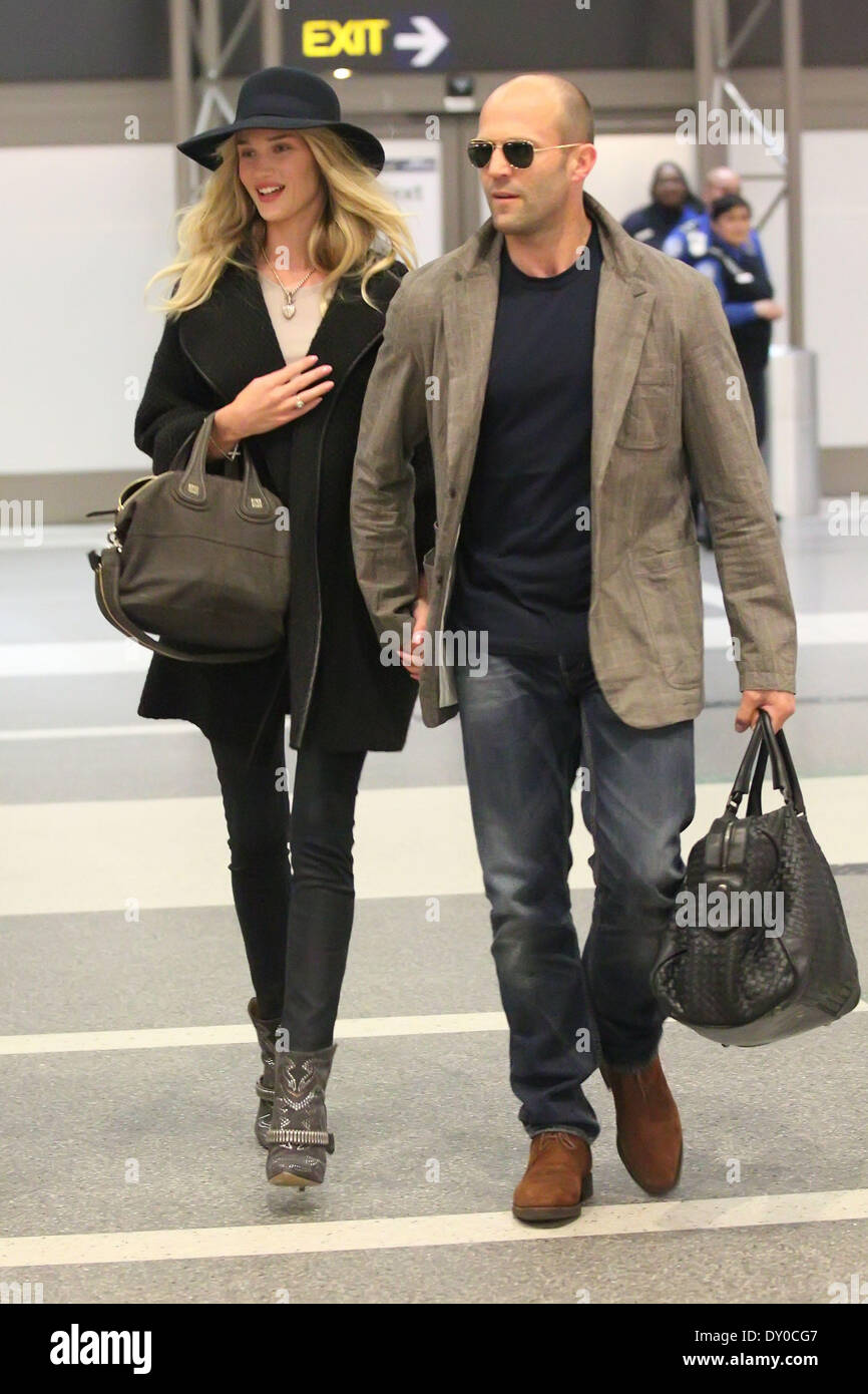 Jason Statham and his girlfriend Rosie HuntingtonWhiteley arrive at