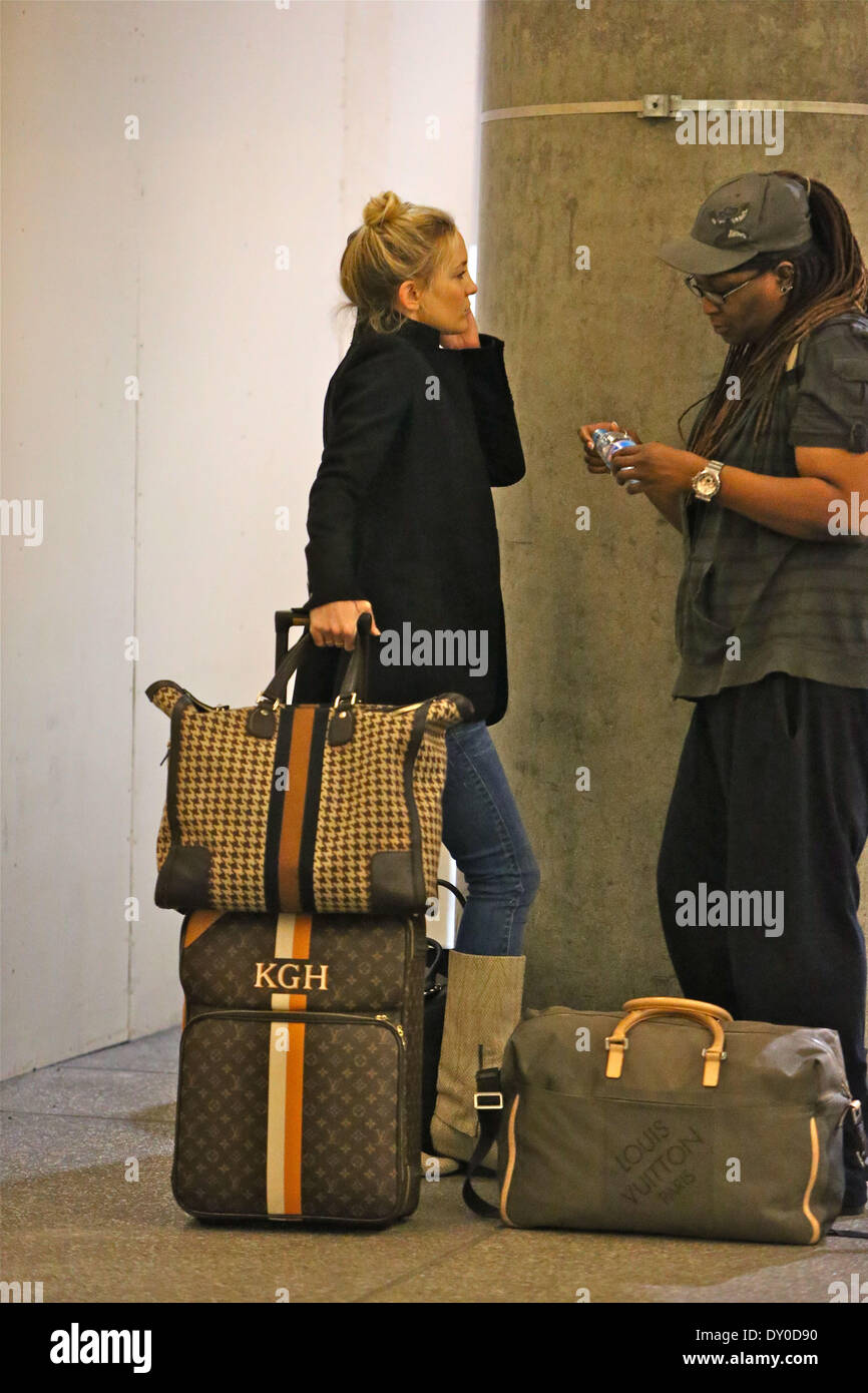 Kate Hudson arriving at LAX airport with personalised Louis