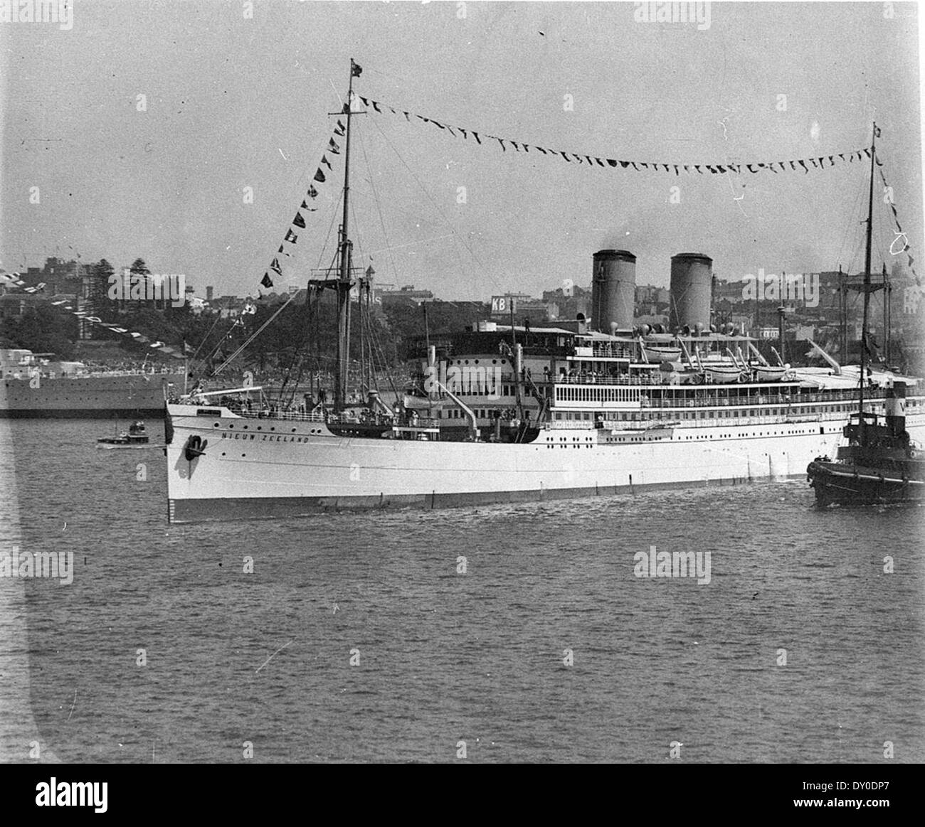 Dutch liner 'Nieuw Zeeland' passing the moored HMAS 'Canberra', Sydney Harbour Bridge opening, 19 March 1932 / Sam Hood Stock Photo