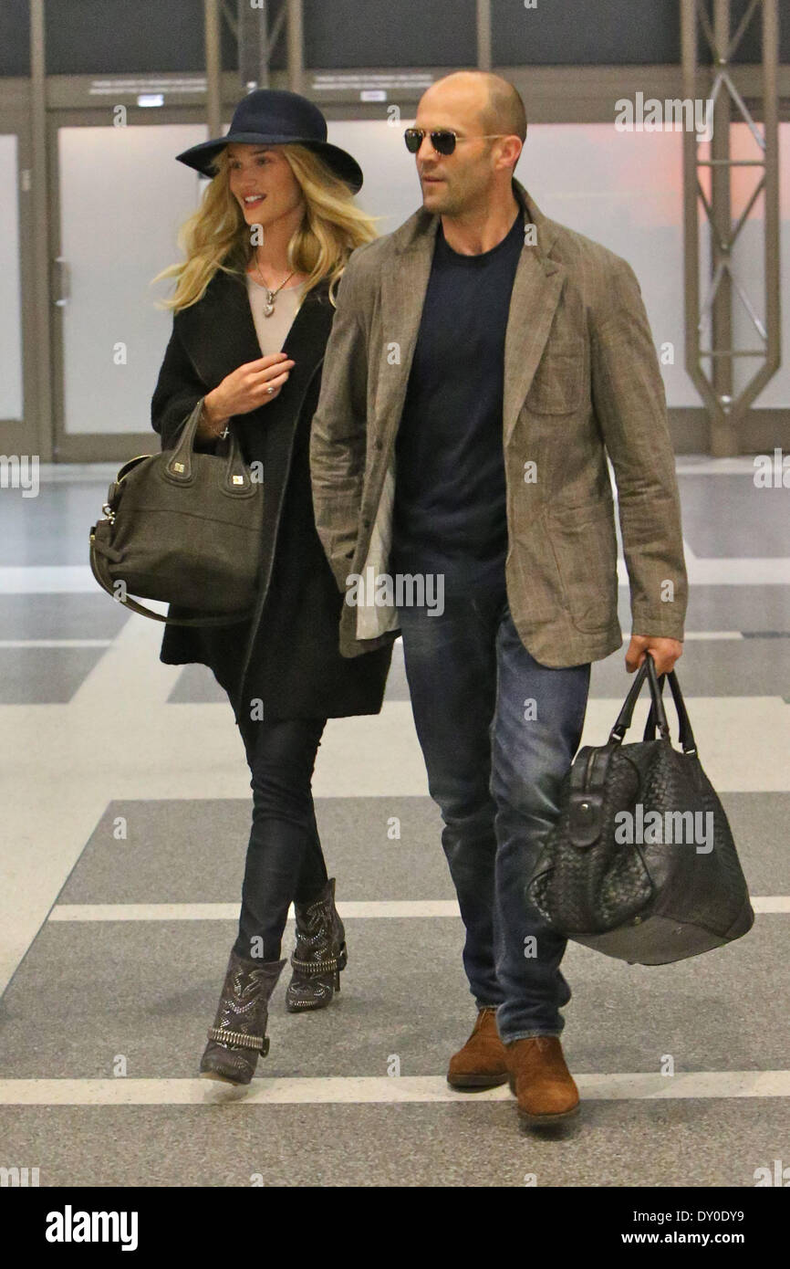 Jason Statham and Rosie Huntington-Whiteley arriving at LAX airport holding  hands Featuring: Jason Statham,Rosie Huntington-Whiteley Where: Los Angeles  California United States When: 10 Dec 2012 Stock Photo - Alamy