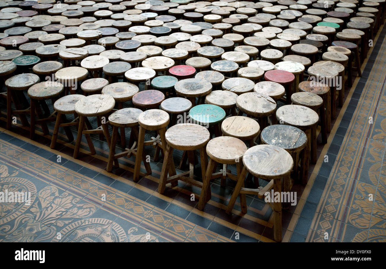 Berlin, Germany. 02nd Apr, 2014. The installation 'Stools' by Chinese  artist Ai Weiwei in the atrium of the Martin-Gropius-Bau in Berlin,  Germany, 02 April 2014. The 6,000 antique wooden stools symbolize how