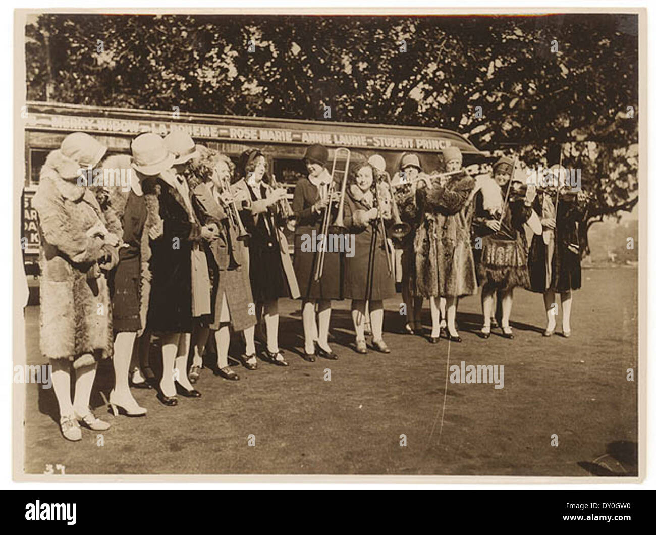 American women's jazz band 'Ingenues' and the 'Trackless Train', Sydney, late 1920's / Sam Hood Stock Photo