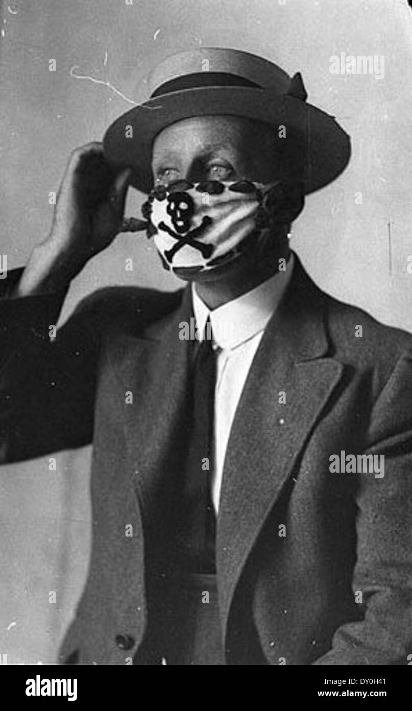Compulsory mask, brought in to combat the flu epidemic after the World War, 1918-1919 / Sam Hood Stock Photo