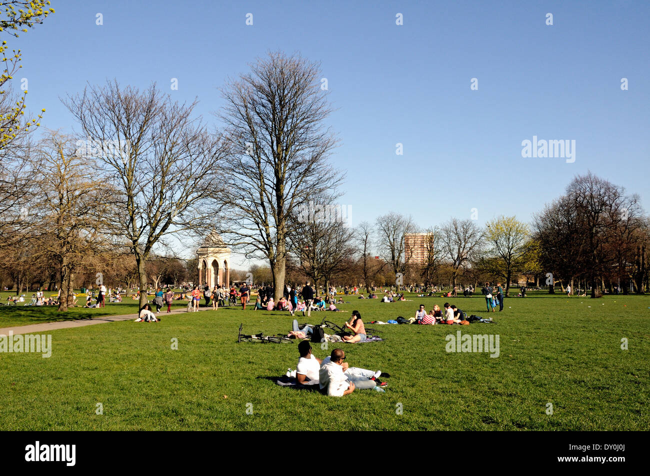 People sitting on the grass in Victoria Park, London Borough of Tower Hamlets, England Britain UK Stock Photo