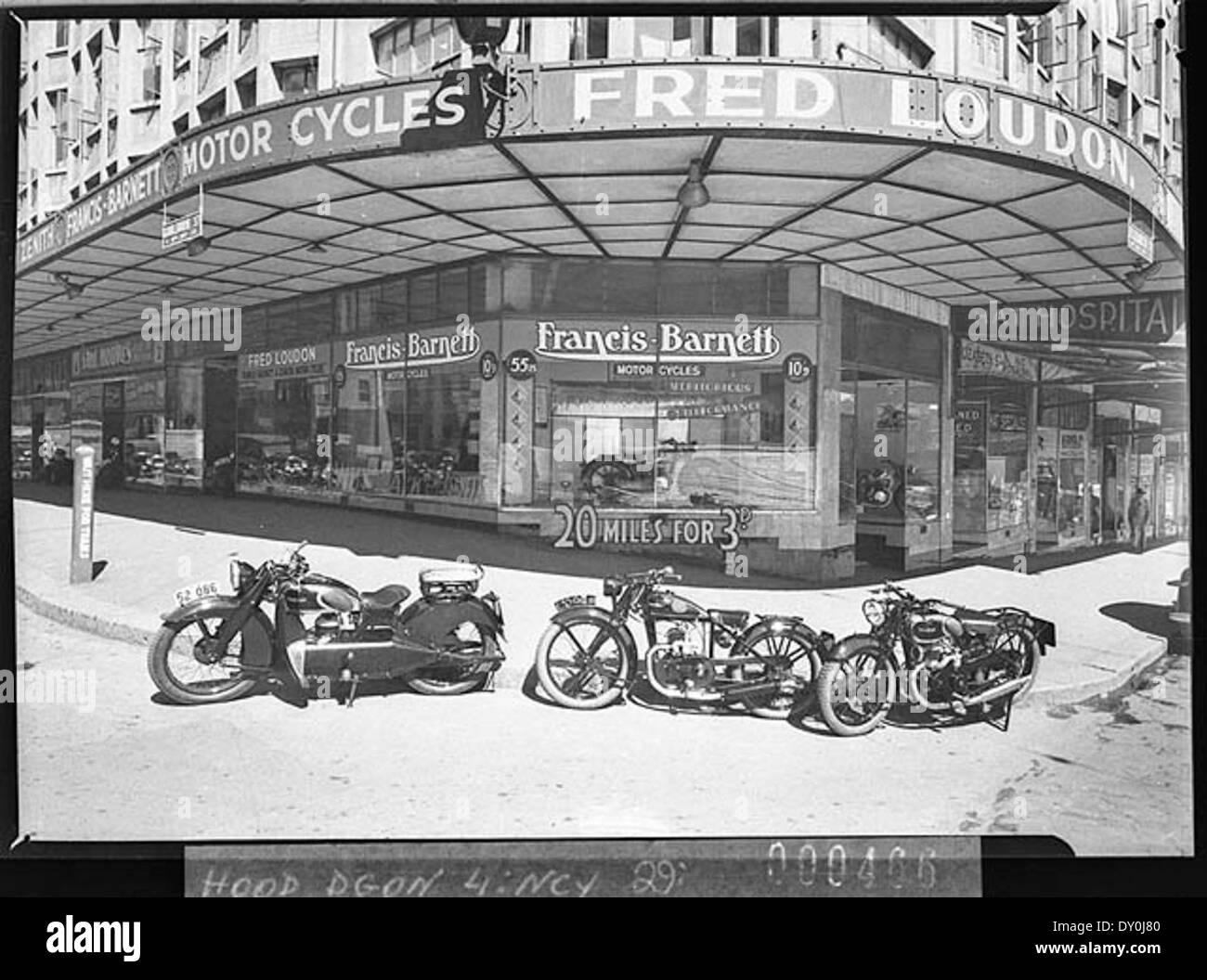 Fred Loudon's motorcycle shop with Francis-Barnett motorcycles, corner Elizabeth and Goulburn Street, Sydney, 1 March 1938, by Sam Hood Stock Photo