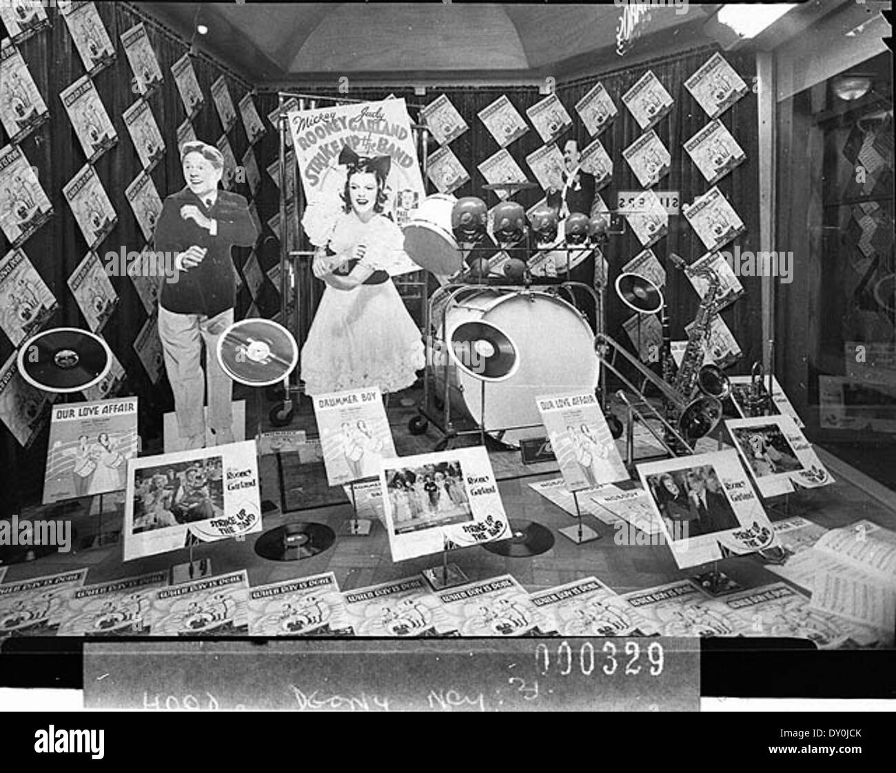 A window display for the 1941 film *Strike up the Band*, taken for M.G.M. The display highlights the film's promotional material and visual appeal, a common method for marketing in early Hollywood. Stock Photo