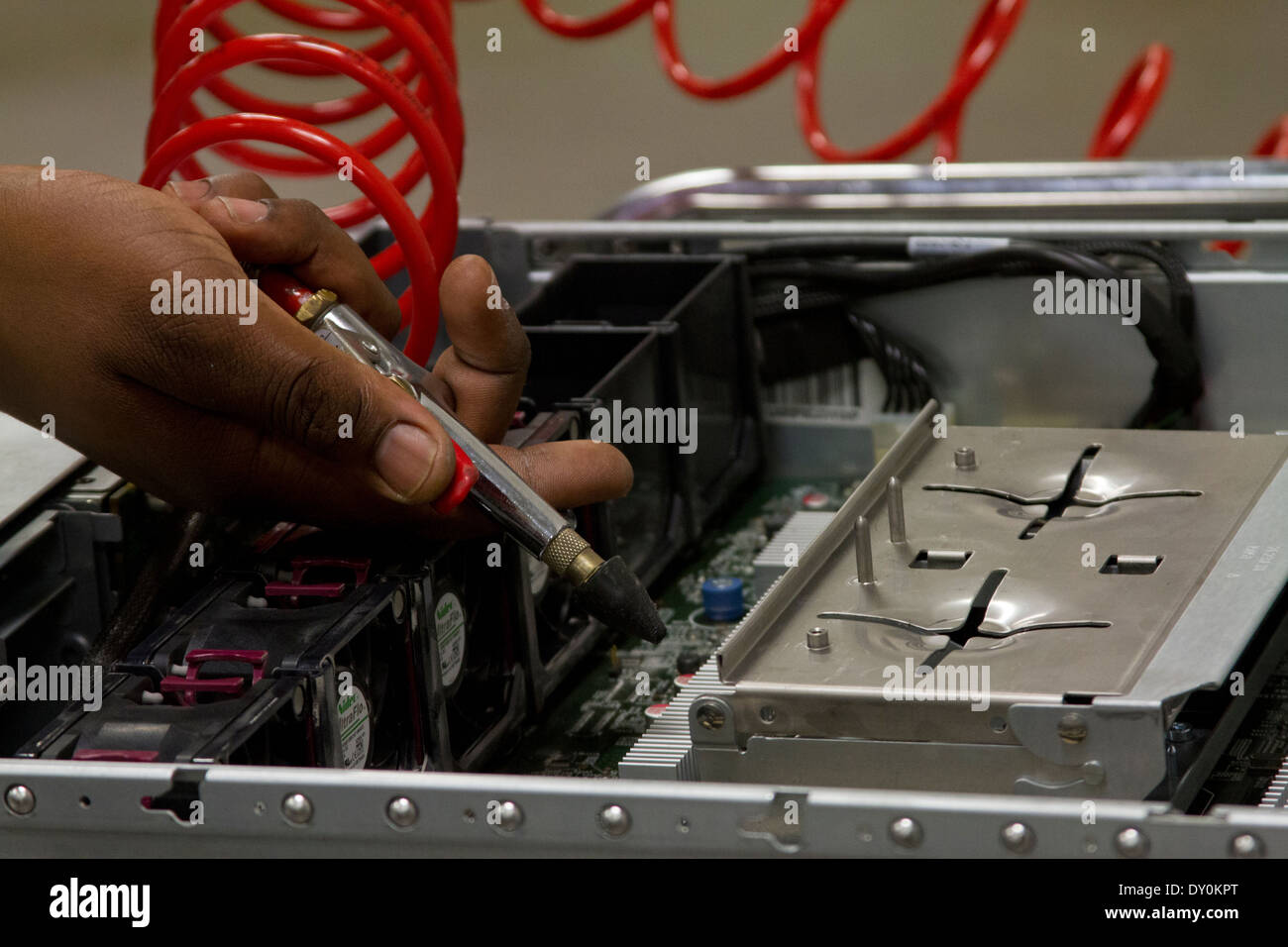 worker blowing air and cleaning HP computer server Stock Photo Alamy