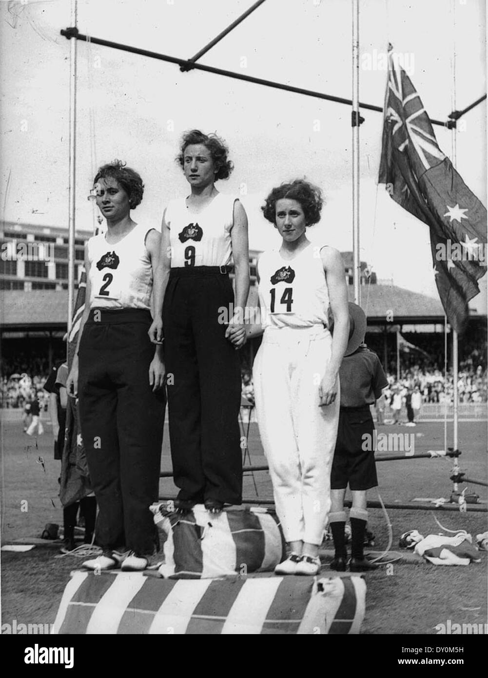 Decima Norman, Jean Coleman and Eileen Wearne win gold, silver and bronze medals for Australia in the 220 yard sprint, Empire Games, Sydney, 11 February 1938 / photographer Sam Hood Stock Photo