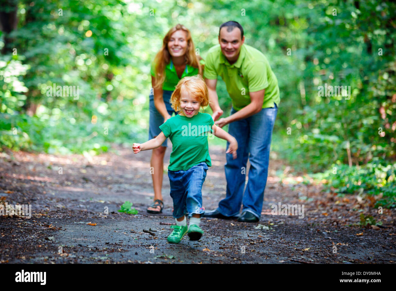 Portrait of Happy Family In Park - outdoor shot Stock Photo - Alamy