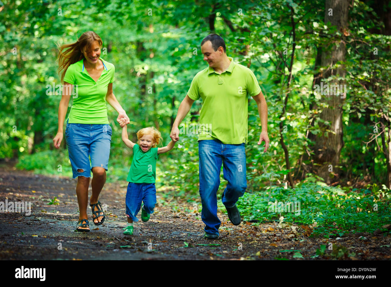 Portrait of Happy Family In Park - outdoor shot Stock Photo - Alamy