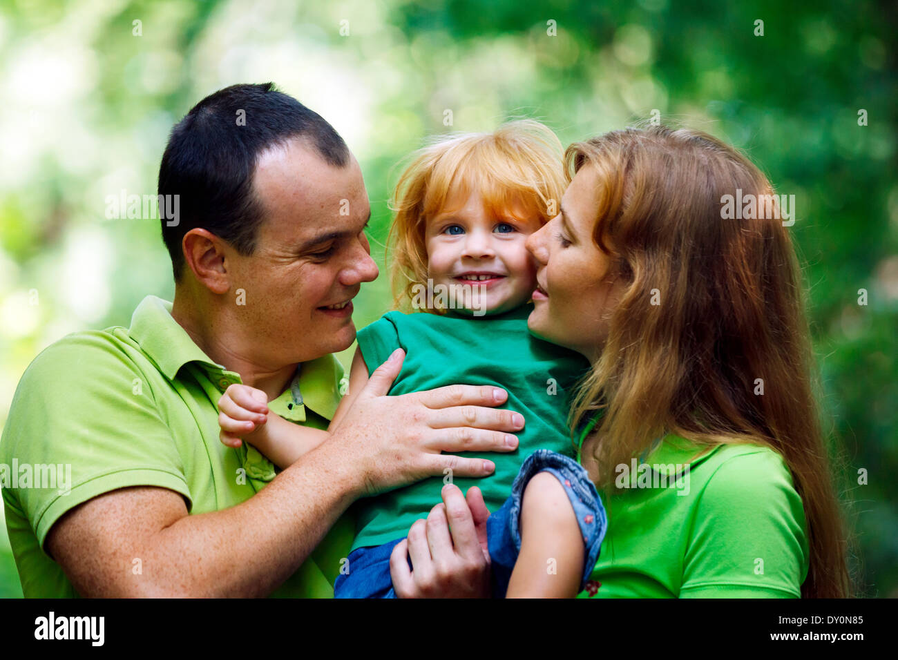 Portrait of Happy Family In Park - outdoor shot Stock Photo - Alamy