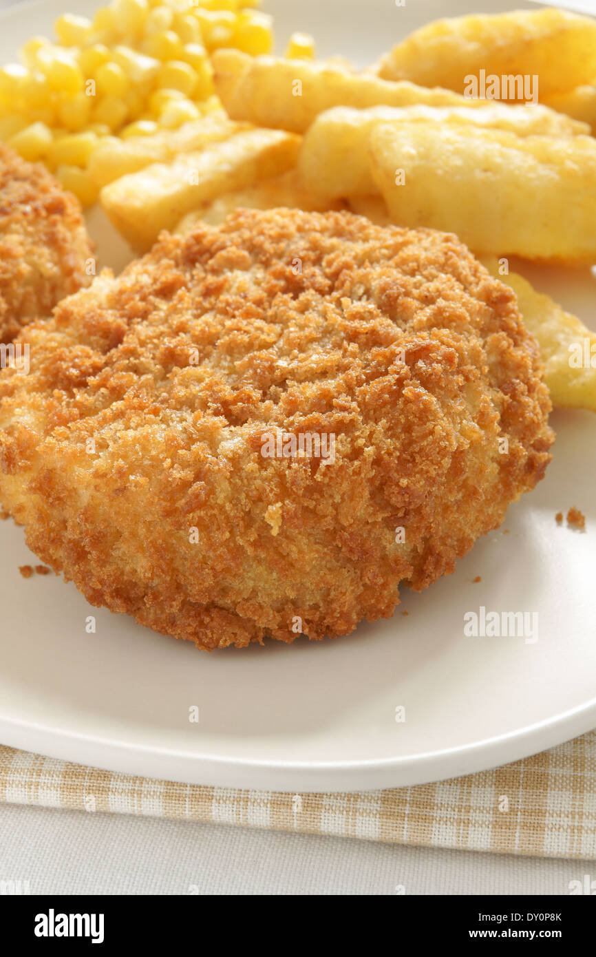 Fishcake with chips and sweet corn Stock Photo