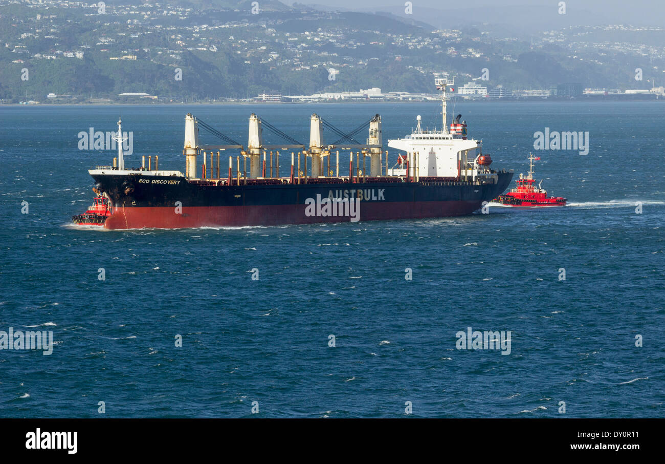 Cargo ship and tugboats, Wellington, New Zealand Stock Photo
