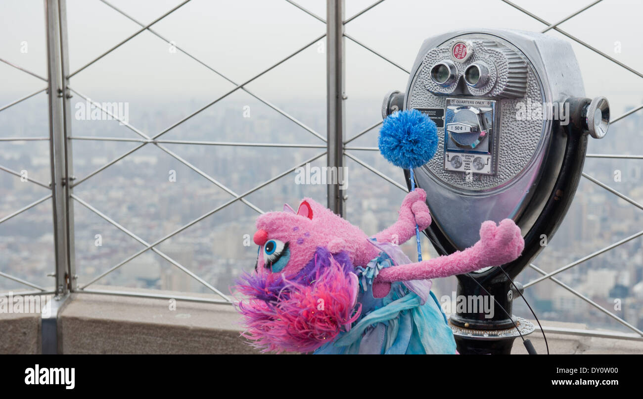 Manhattan, New York, USA. 2nd Apr, 2014. Sesame Street's Abby Cadabby and Autism speaks co-founders Suzanne and Bob Wright light the Empire State Building blue to celebrate World Autism Awareness Day, Wednesday, April, 2, 2014. Credit:  Bryan Smith/ZUMAPRESS.com/Alamy Live News Stock Photo