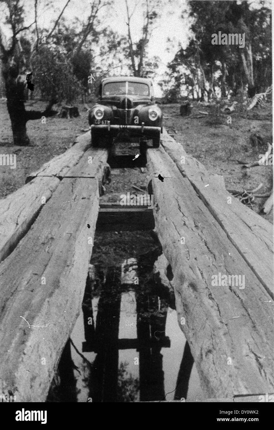 1940 Ford V-8 or Mercury car crossing Woolooma-Balpool bridge - Deniliquin, NSW, 1930 by Garry Daly Stock Photo