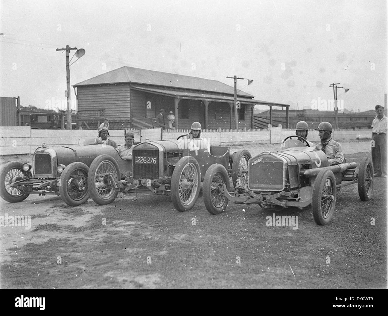 From left, supercharged 1924 Alvis of Fred Braitling, no.4 (registration no. 226-276) is the Fronty Ford Special of Charlie Spurgeon and no.3 is the Rajo Ford Special of Don Shorten, taken for Cinesound, Wentworth Autodrome, Nov 1933, Ted Hood Stock Photo