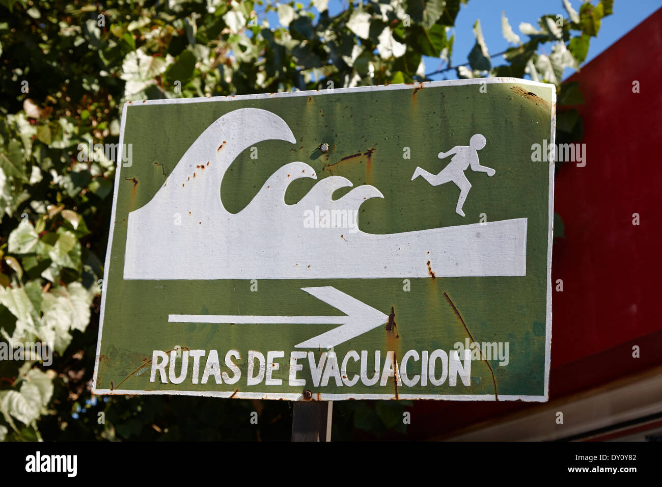 Tsunami hazard warning zone evacuation route sign constitucion Chile Stock Photo